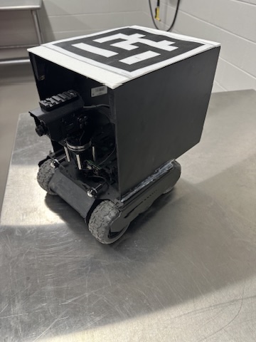 Side view of the finished rover unit on a stainless table
